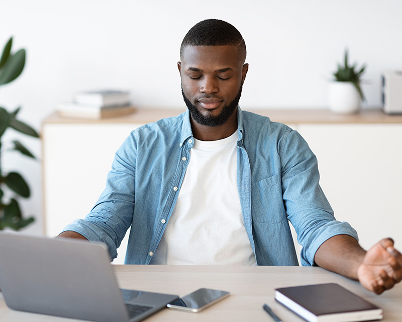 Black man having an online therapy session for Borderline Personality Disorder, using mindfulness in DBT